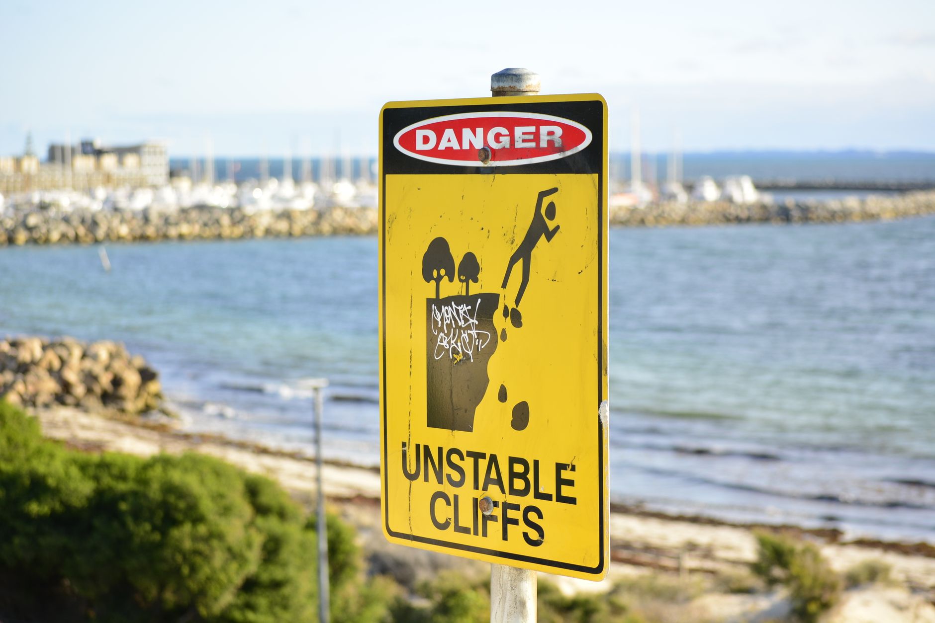 warning sign at unstable coastal cliffs